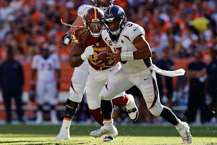 Washington Commanders defensive end Chase Young chasing down Denver Broncos quarterback Russell Wilson.